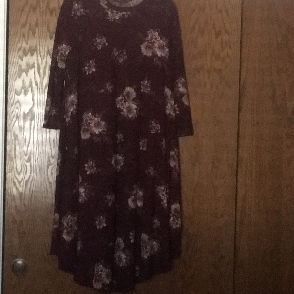 Calf length burgundy dress with floral design.